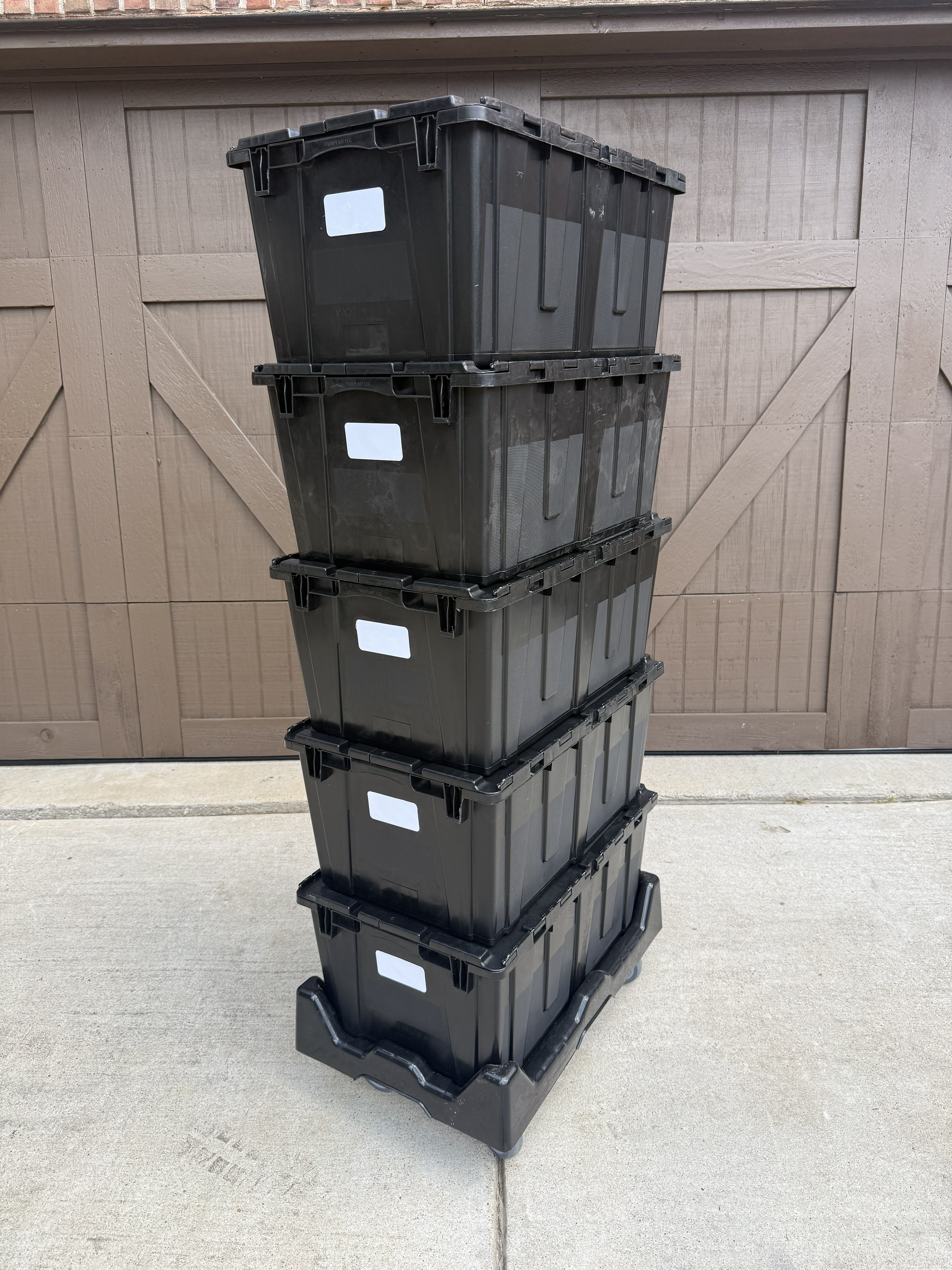 Black moving bins stacked