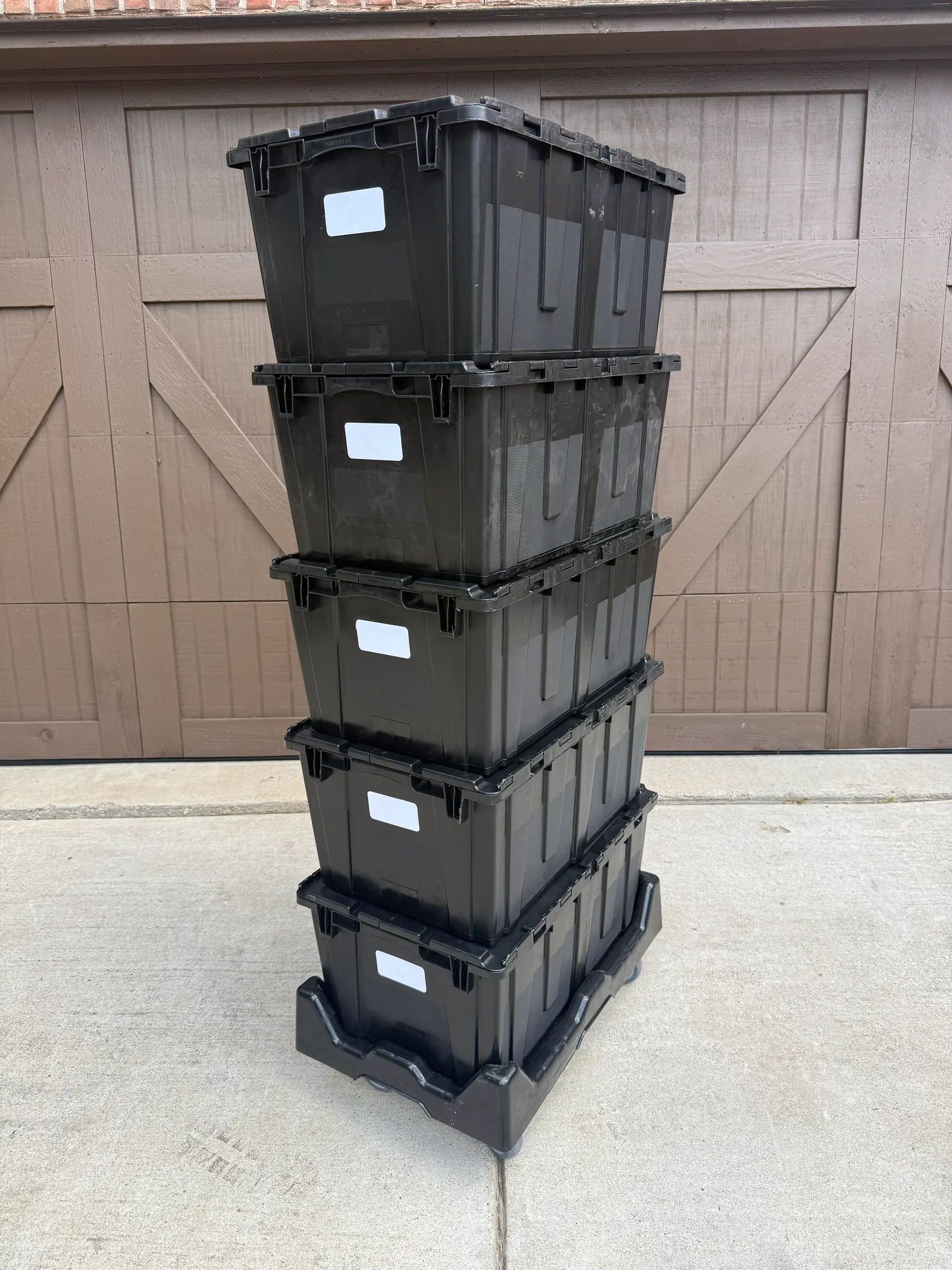 Black moving bins stacked